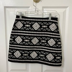 Black embroidered skirt with gold detailing